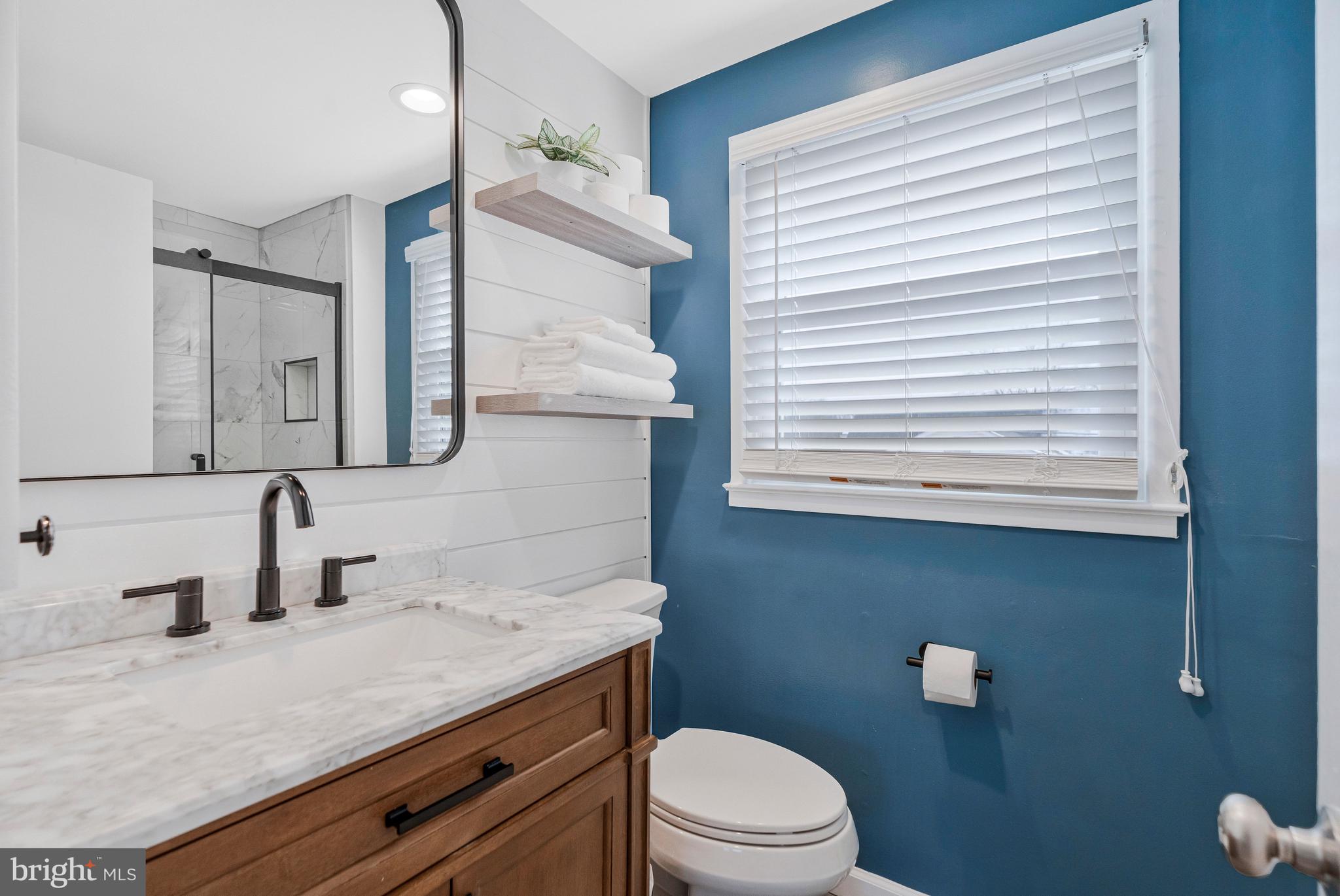 13127 Parson Lane Fairfax, VA 22033 - Photo 28 of 44 a bathroom with a granite countertop sink vanity mirror and toilet