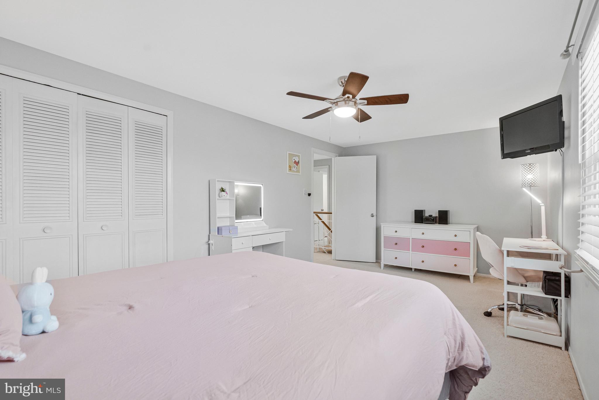 13127 Parson Lane Fairfax, VA 22033 - Photo 32 of 44 a bedroom with a bed and a flat screen tv