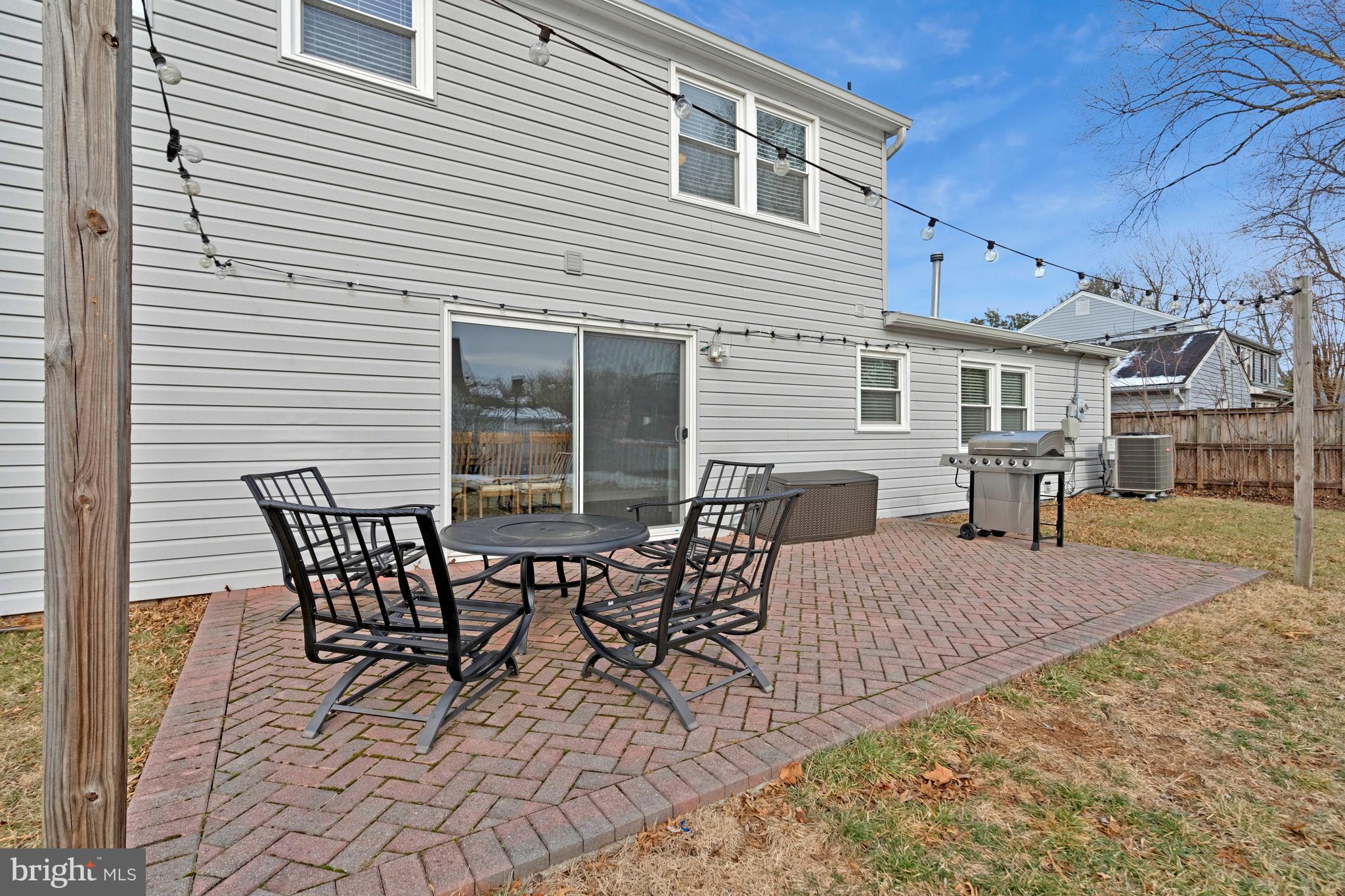 13127 Parson Lane Fairfax, VA 22033 - Photo 42 of 44 a view of a patio with table and chairs and wooden floor