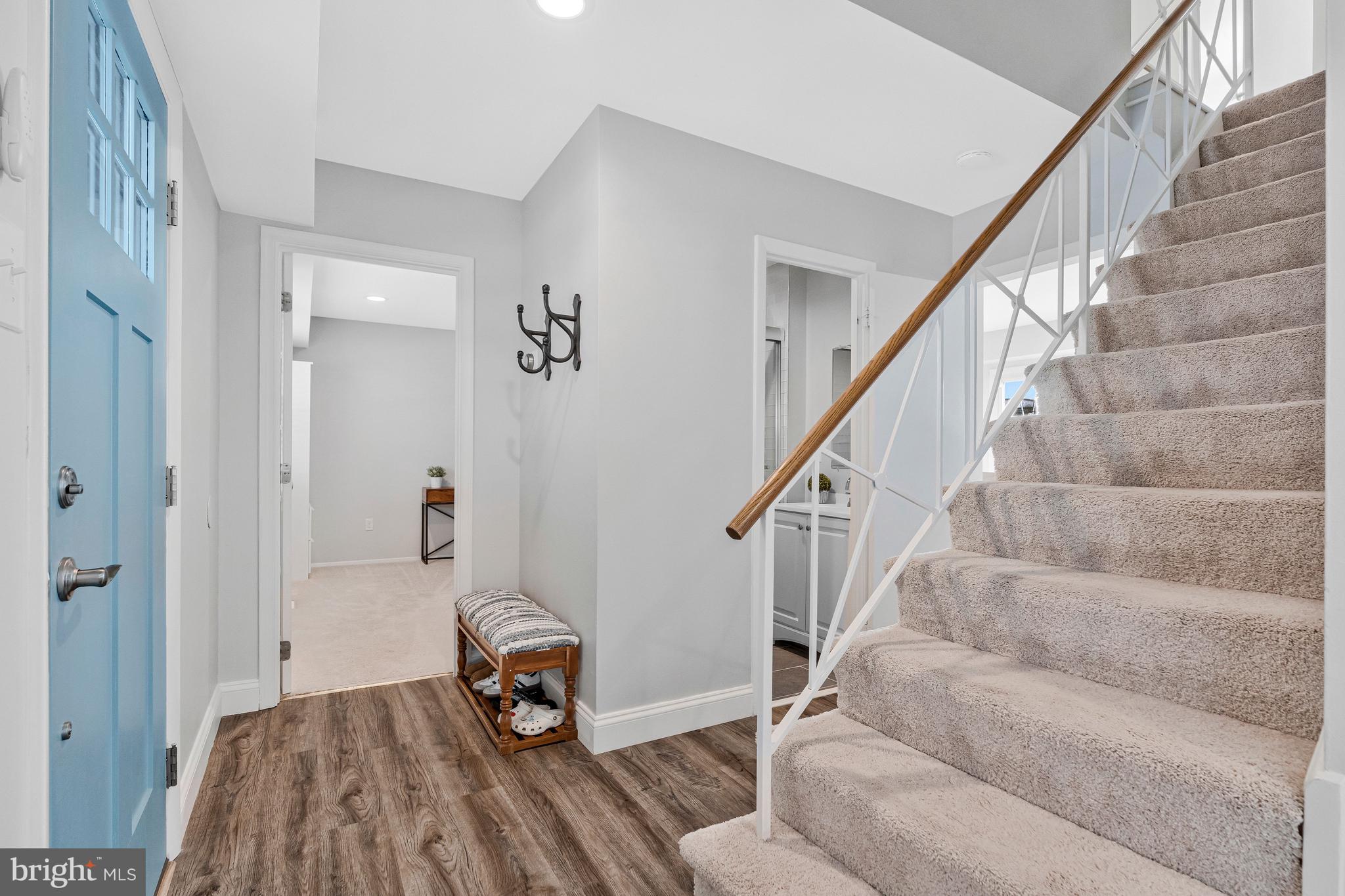 13127 Parson Lane Fairfax, VA 22033 - Photo 8 of 44 a living room with stairs and a wooden floor