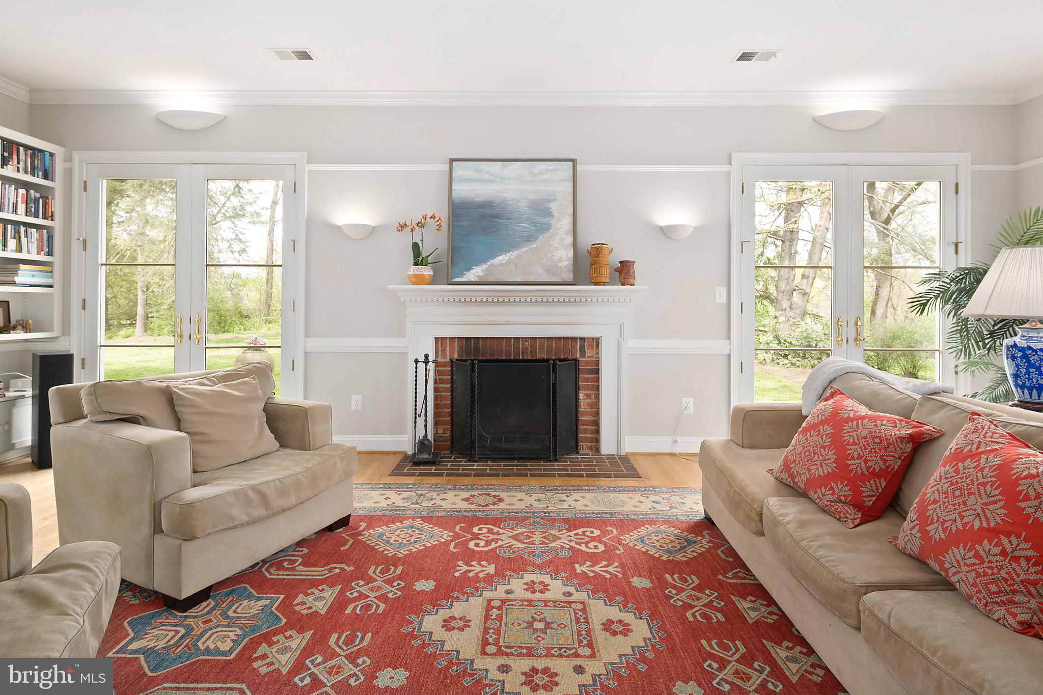 1213 Towlston Road McLean, VA 22102 - Photo 13 of 50 Family room w/fireplace and French doors to patio