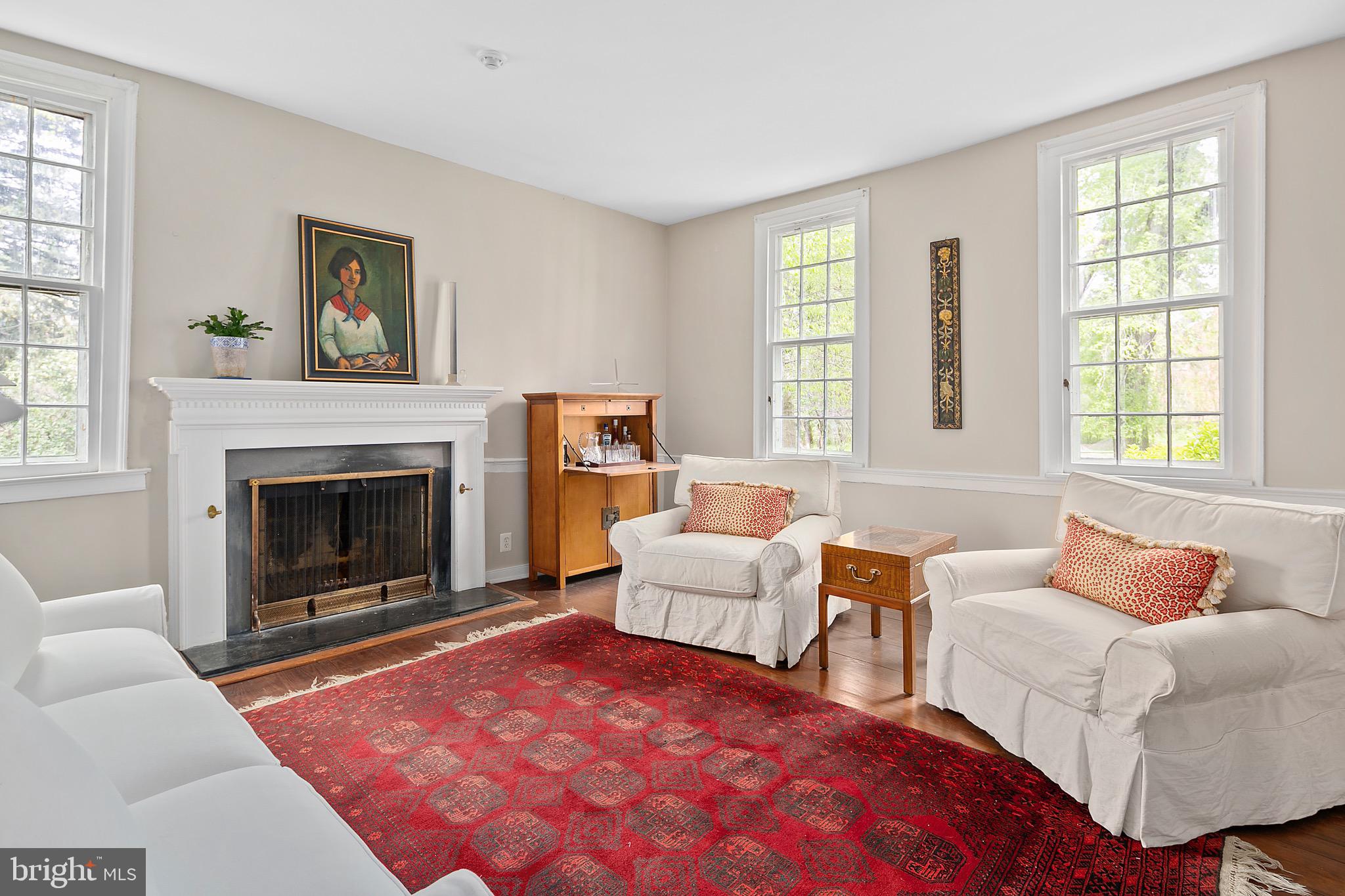 1213 Towlston Road McLean, VA 22102 - Photo 21 of 50 Living room with fireplace and large windows