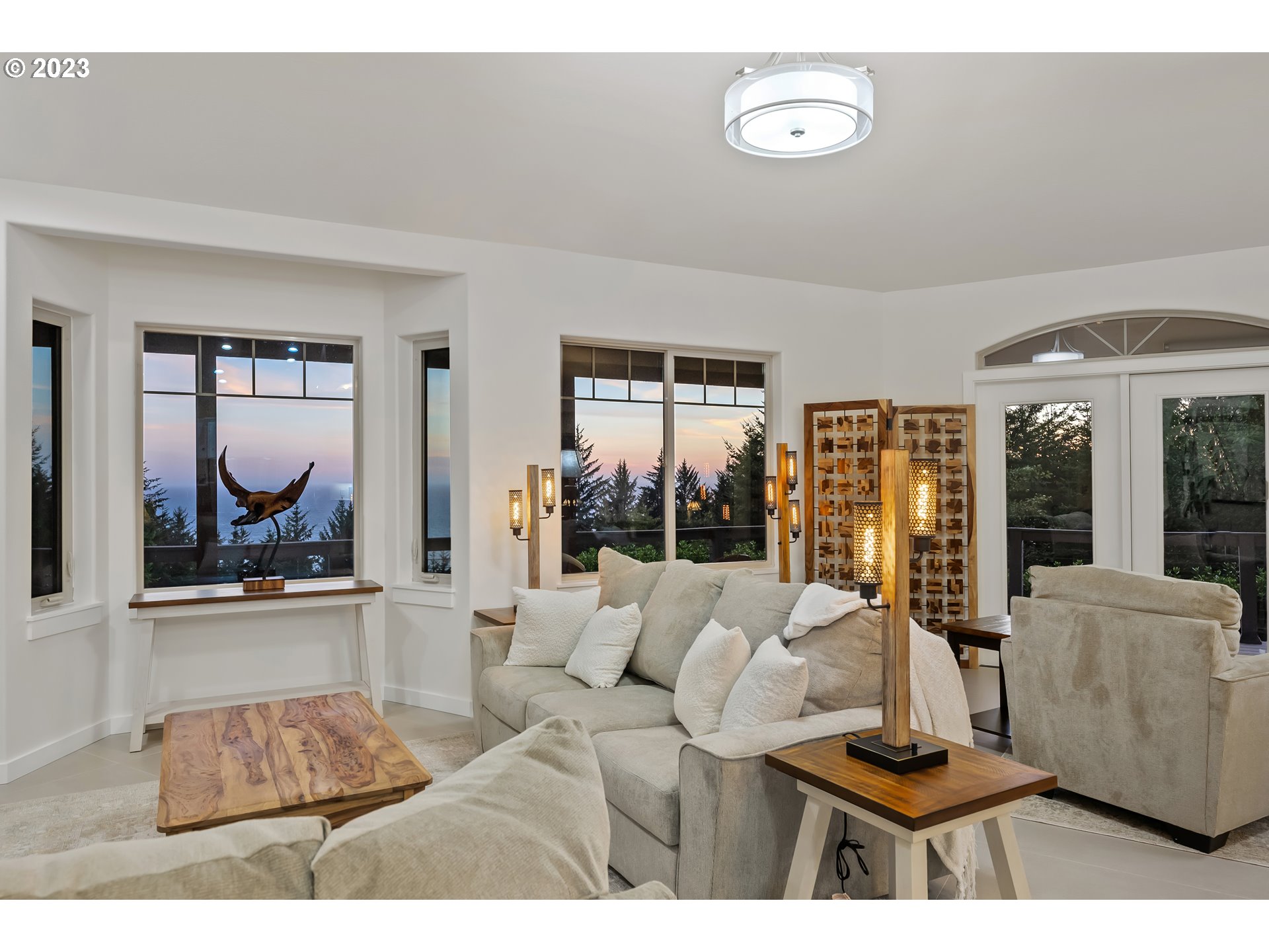 19630 McDonald Road Brookings, OR 97415 - Photo 2 of 36 a living room with furniture and a large window