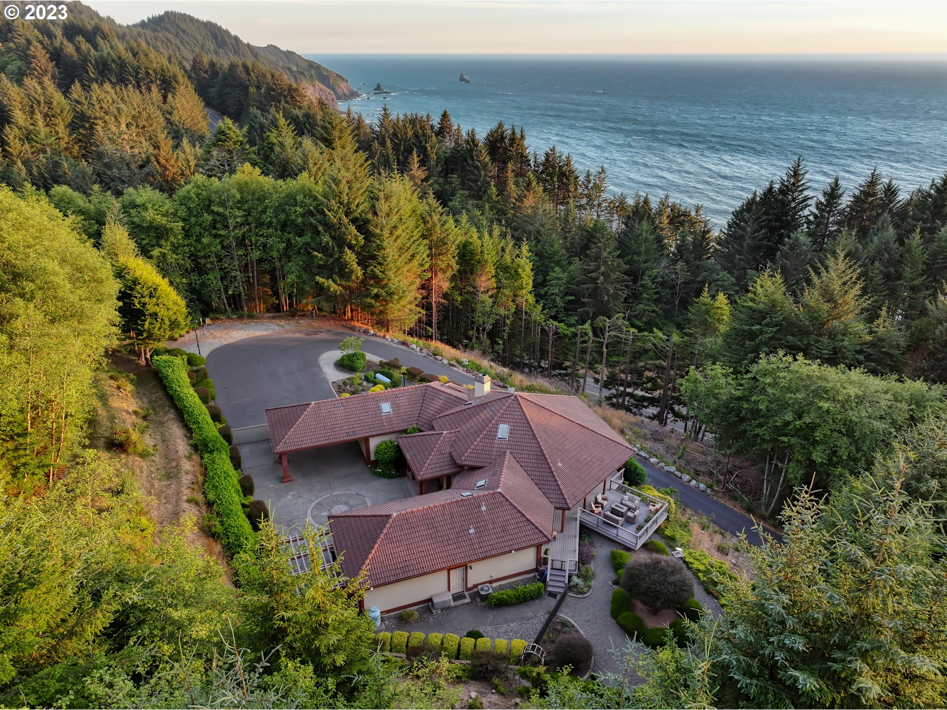 19630 McDonald Road Brookings, OR 97415 - Photo 32 of 36 an aerial view of a house with a garden