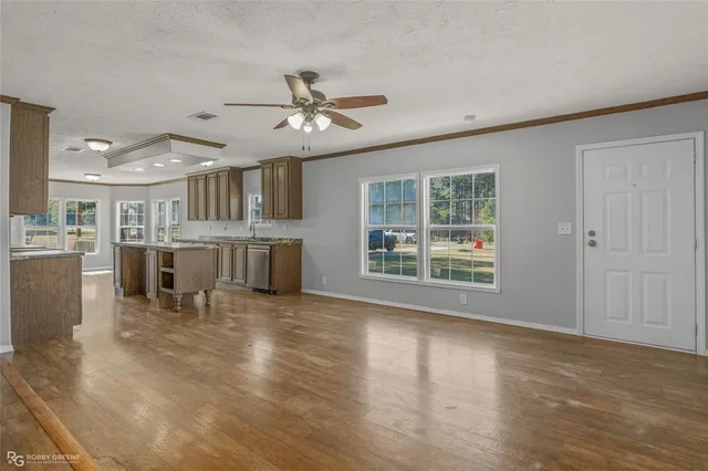 a view of a livingroom with furniture window and wooden floor