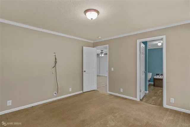 an empty room with closet and wooden floor
