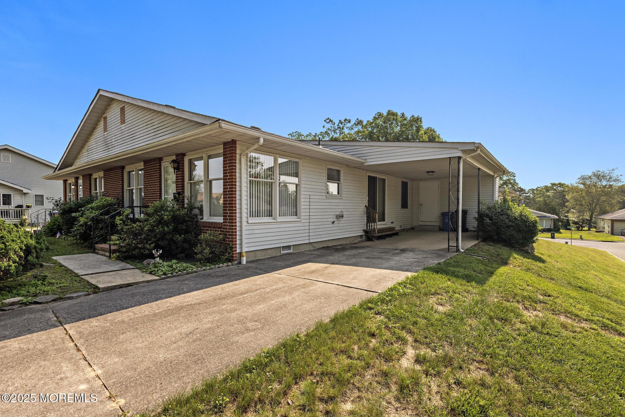 43B Sycamore Access Road, Unit B Manahawkin, NJ 08050 - Photo 1 of 35 a front view of a house with a yard