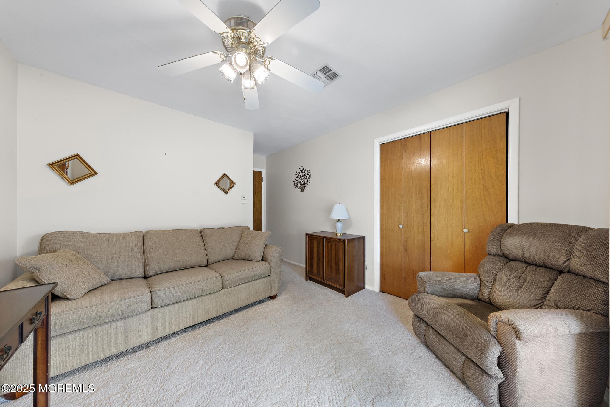 43B Sycamore Access Road, Unit B Manahawkin, NJ 08050 - Photo 26 of 35 a living room with furniture and a chandelier