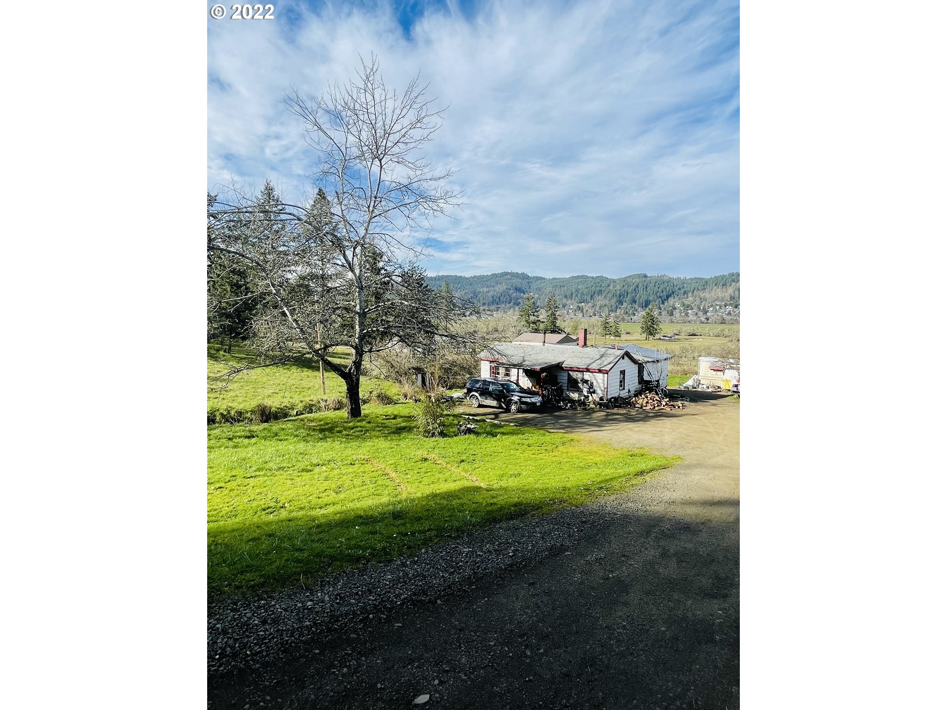 1994 South Side Road Sutherlin, OR 97479 - Photo 1 of 2 a view of a backyard with table and chairs