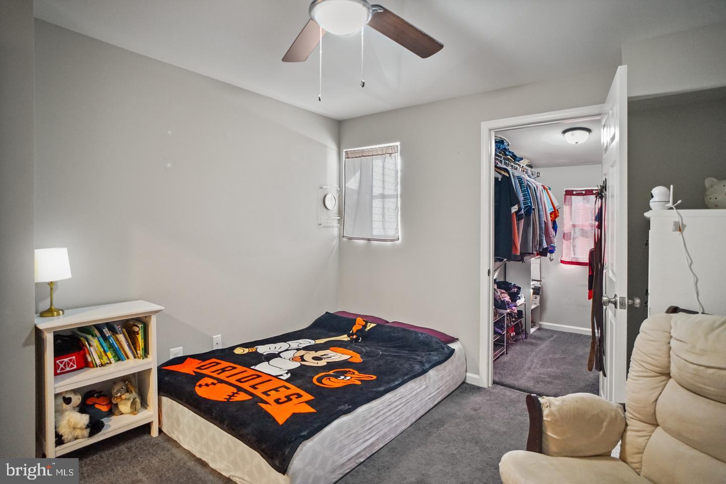1421 Race Street Baltimore, MD 21230 - Photo 12 of 16 a living room with furniture and a baby crib