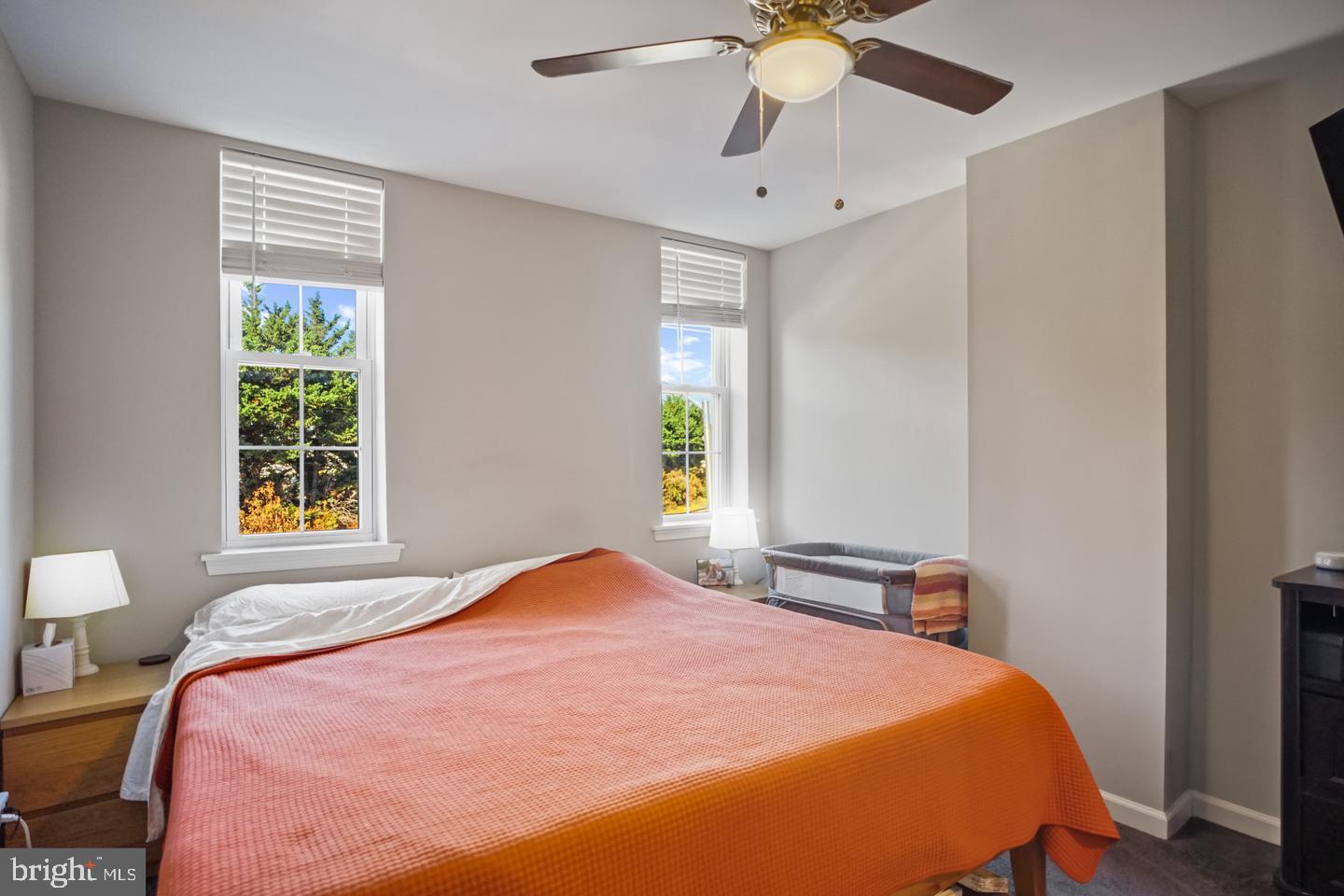 1421 Race Street Baltimore, MD 21230 - Photo 14 of 16 a bedroom with a bed and a chandelier