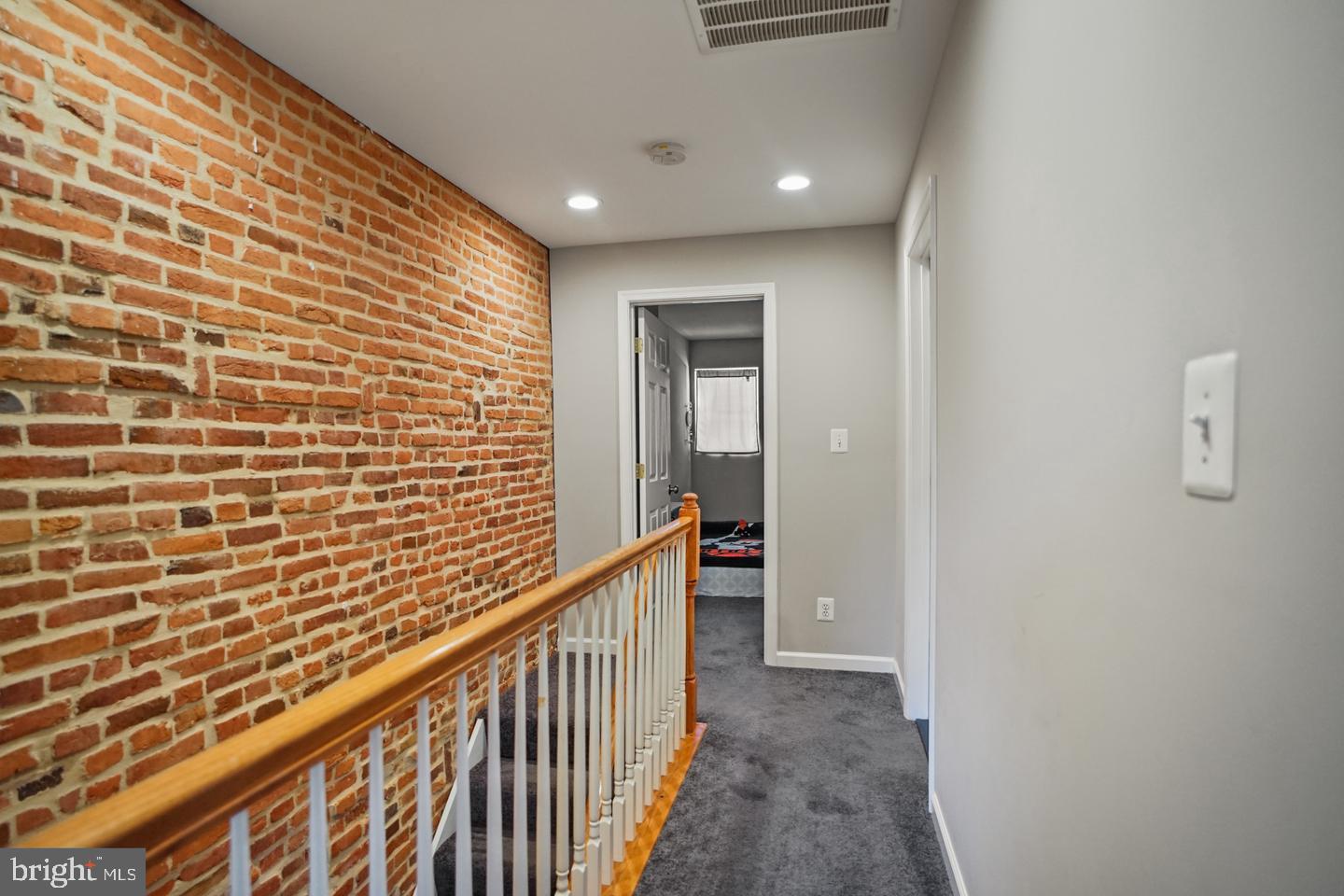 1421 Race Street Baltimore, MD 21230 - Photo 10 of 16 a view of a hallway with wooden floor and staircase