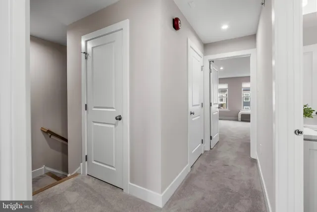 a view of a hallway with a room