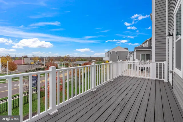 a view of a balcony with wooden floor