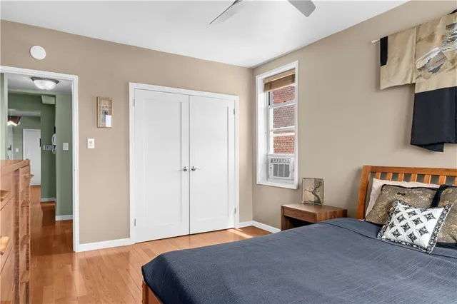 a bedroom with a bed and flat screen tv