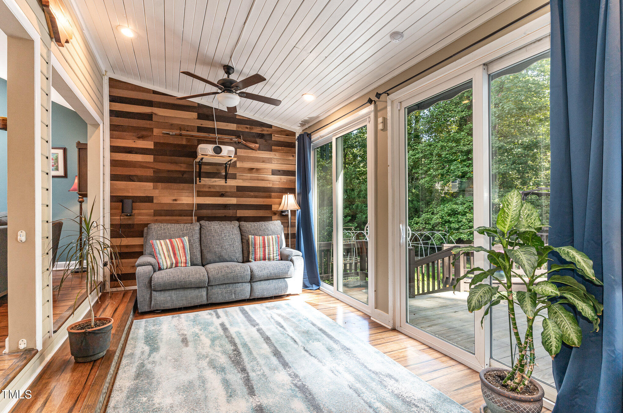 529 Ashebrook Drive Raleigh, NC 27609 - Photo 11 of 35 a living room with furniture cabinets and a large window