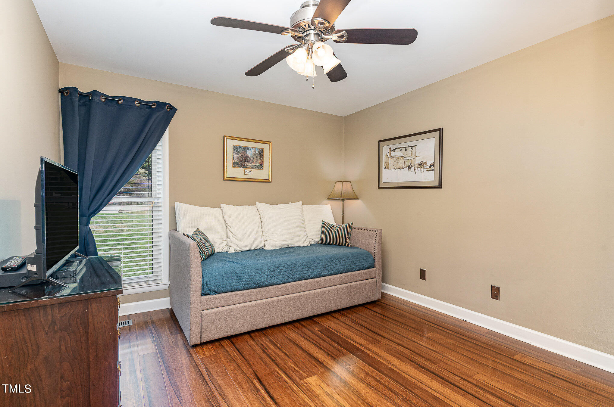 529 Ashebrook Drive Raleigh, NC 27609 - Photo 19 of 35 a living room with furniture and a flat screen tv