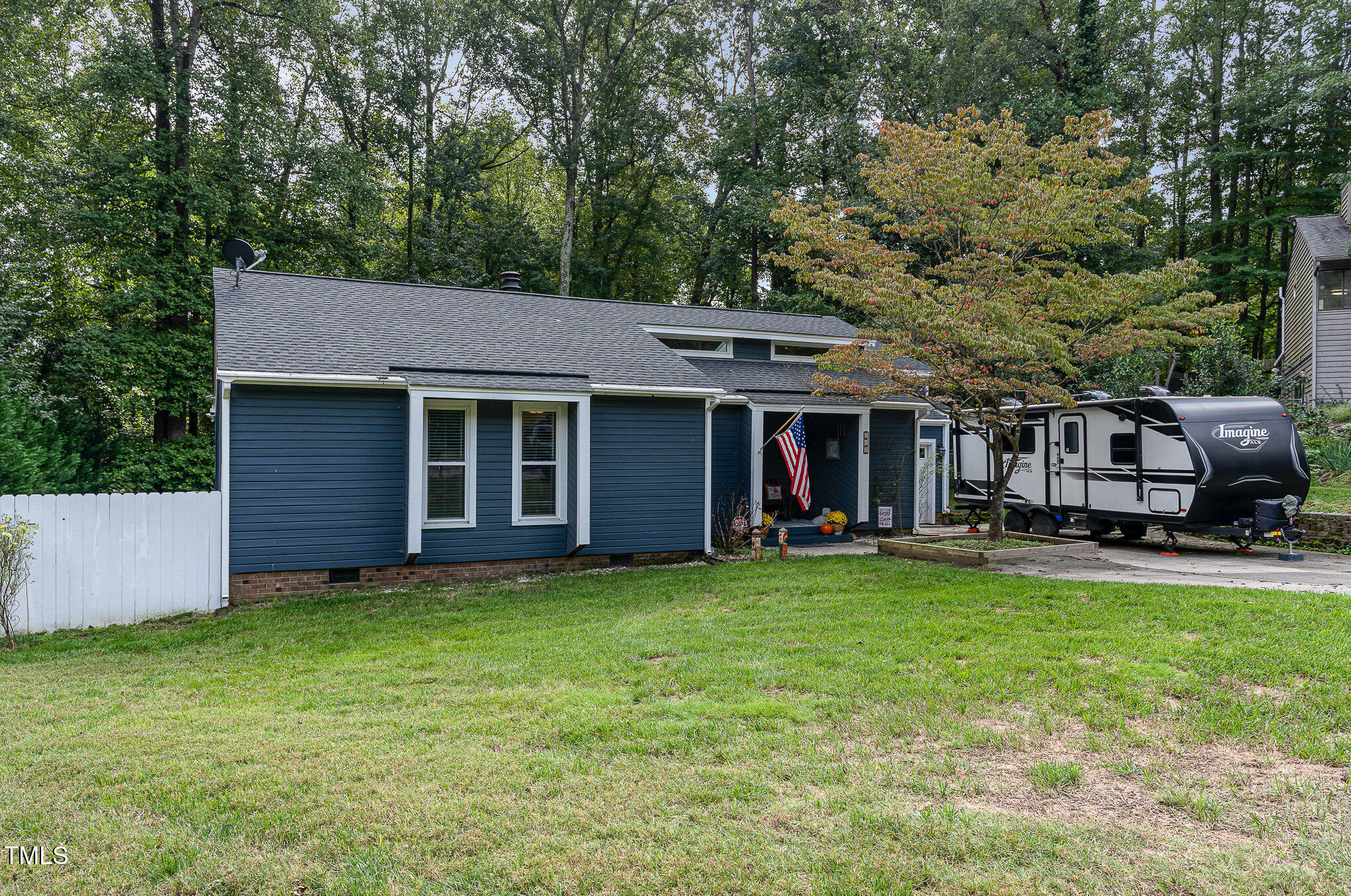 529 Ashebrook Drive Raleigh, NC 27609 - Photo 2 of 35 a view of a house with a yard and sitting area