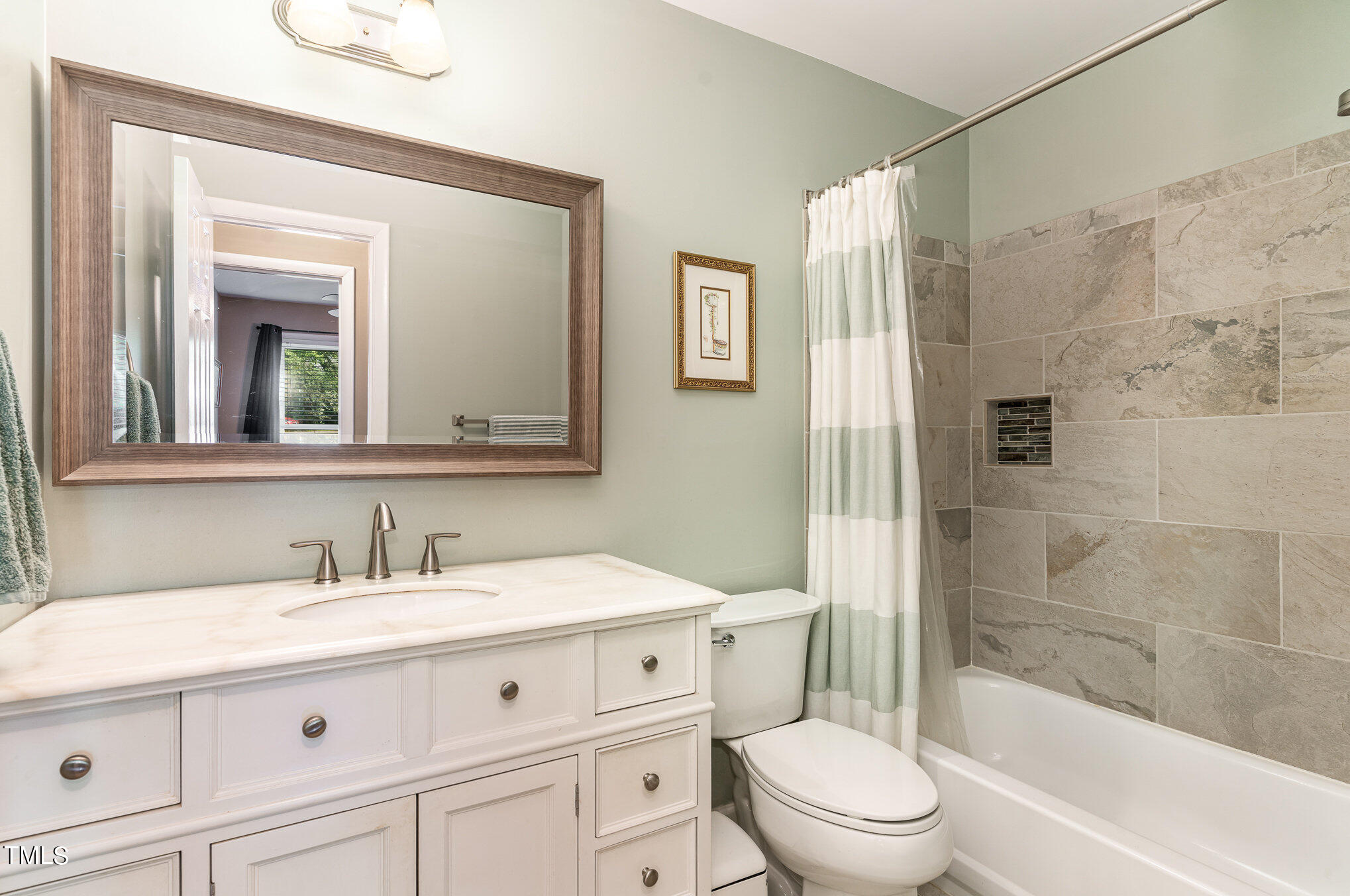 529 Ashebrook Drive Raleigh, NC 27609 - Photo 22 of 35 a bathroom with a sink a toilet and shower