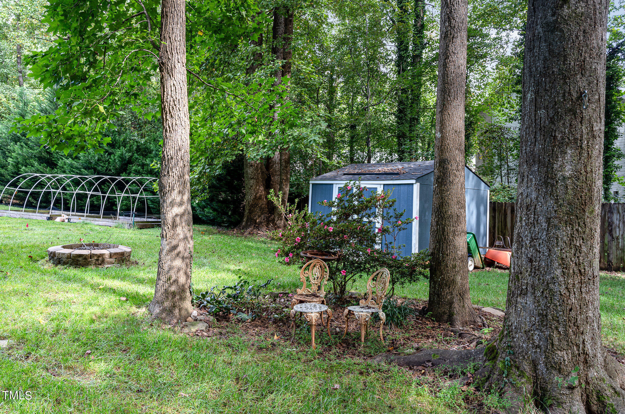 529 Ashebrook Drive Raleigh, NC 27609 - Photo 28 of 35 a view of a house with backyard and a sitting area