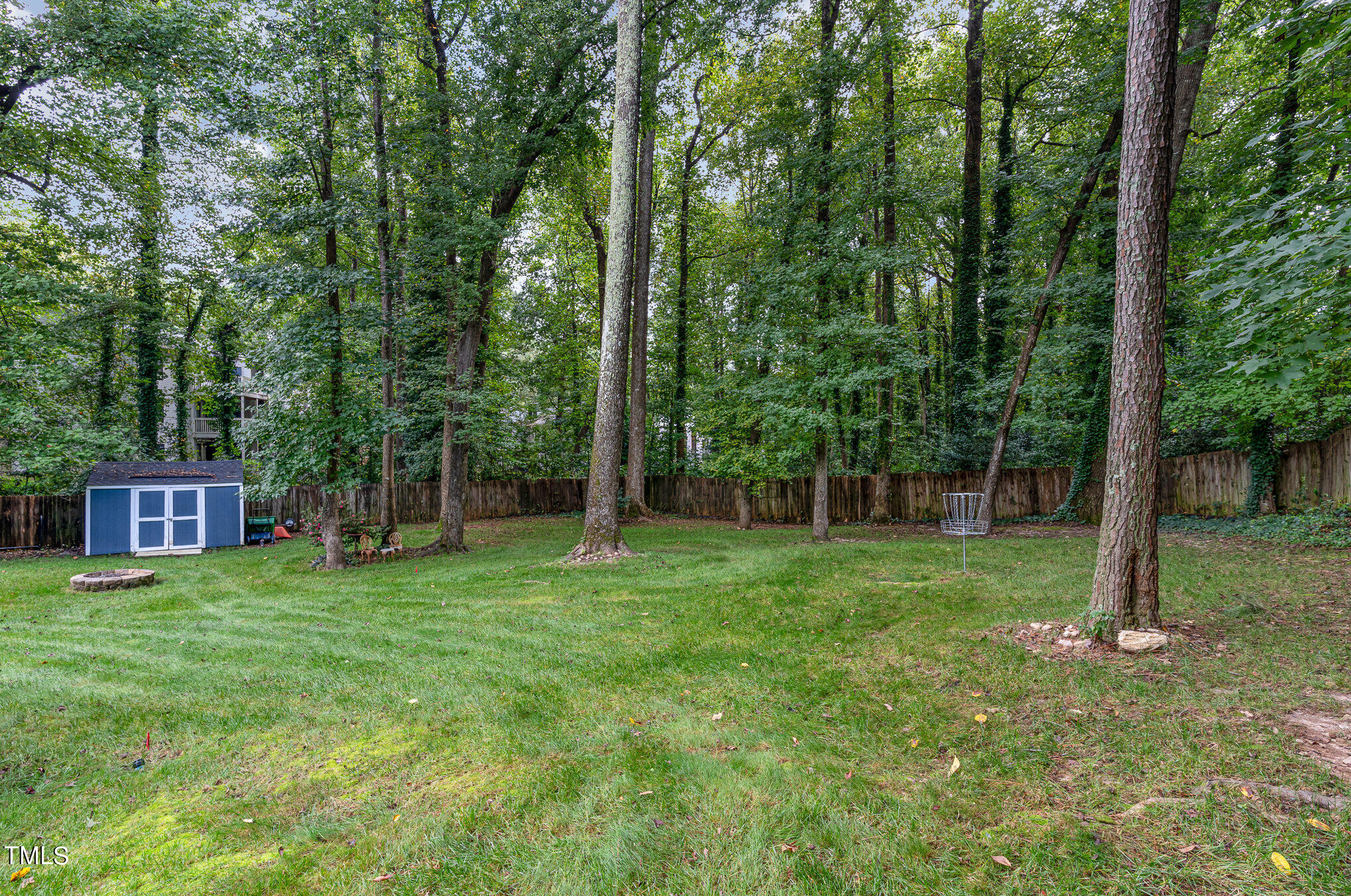 529 Ashebrook Drive Raleigh, NC 27609 - Photo 29 of 35 a view of a yard with a house and a tree