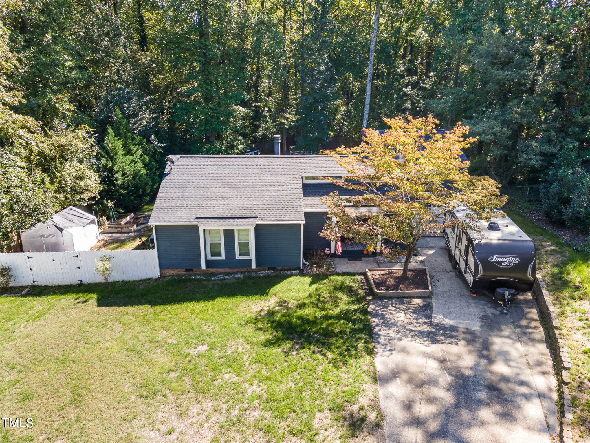 529 Ashebrook Drive Raleigh, NC 27609 - Photo 32 of 35 a view of a house with a yard and sitting area