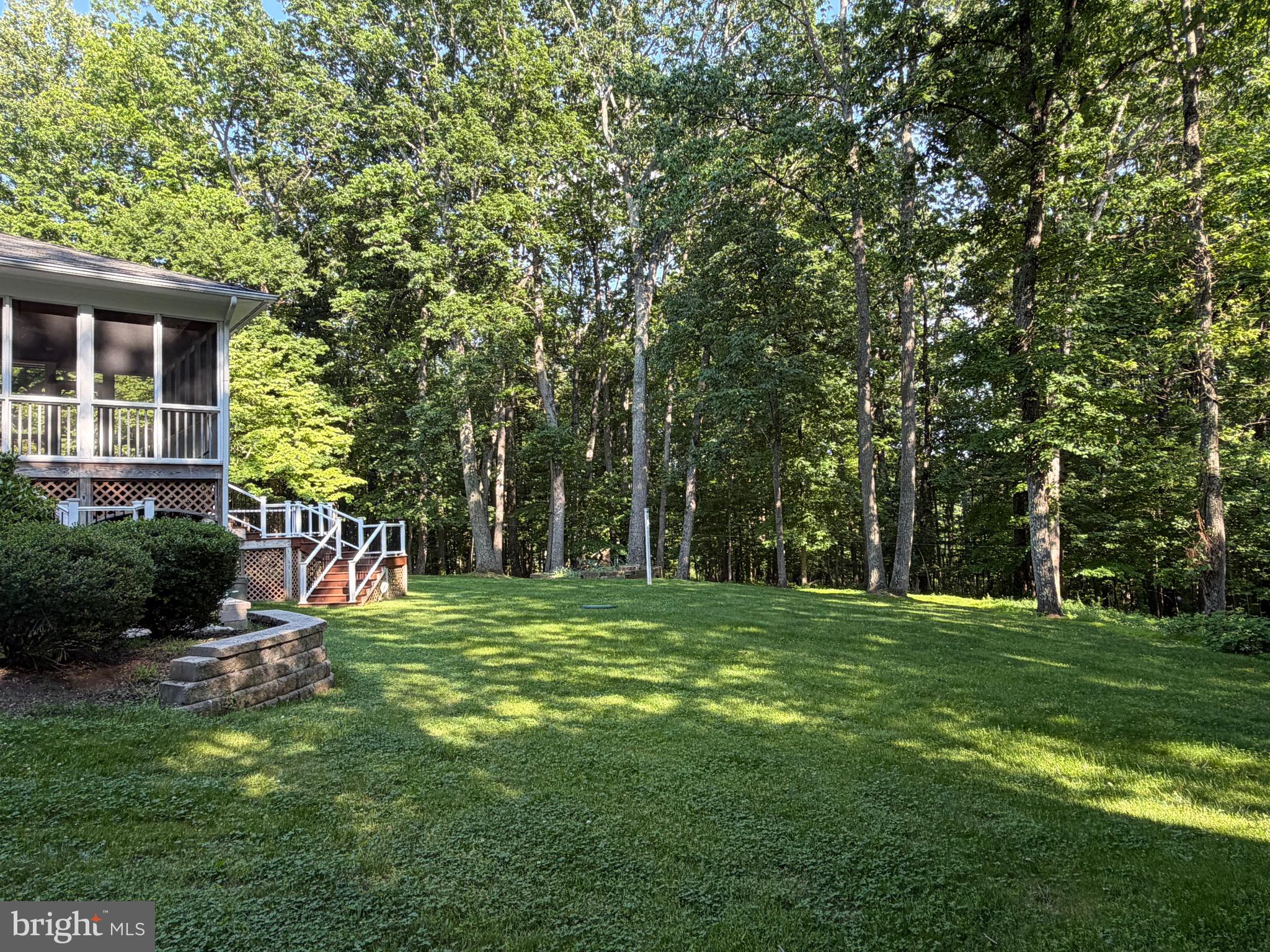 7530 Damascus Road Gaithersburg, MD 20882 - Photo 8 of 12 a view of a backyard with a garden and trees