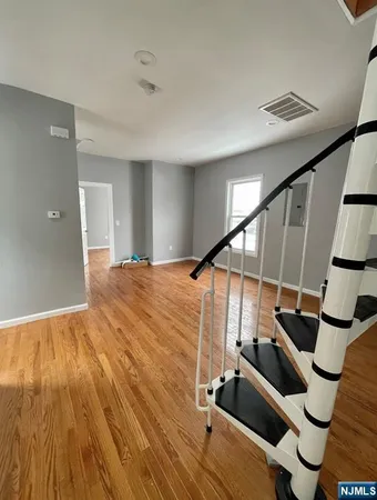 a view of entryway with wooden floor