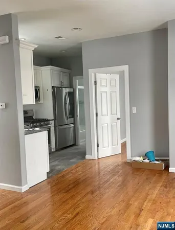 a kitchen with a refrigerator and a stove