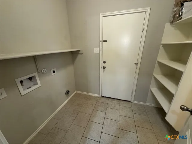 a bathroom with a sink toilet and a mirror