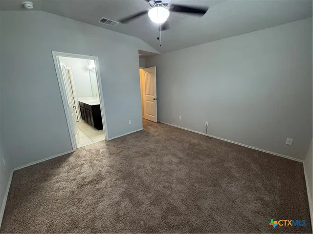 an empty room with a mirror