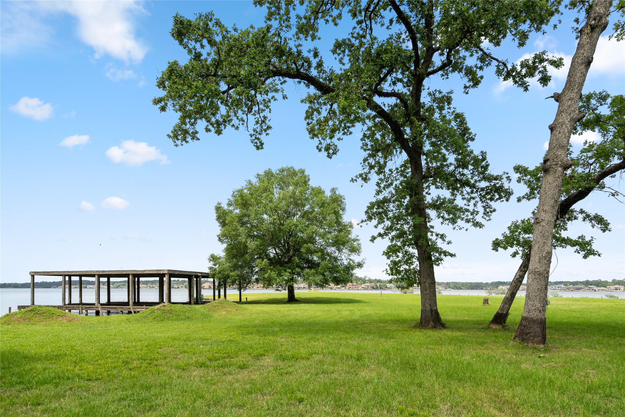 15126 Walden Road Montgomery, TX 77356 - Photo 11 of 50 Three boathouse slips combine functionality and curbside charm for lakeside living.