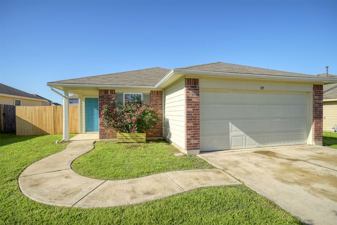 a view of a house with small yard