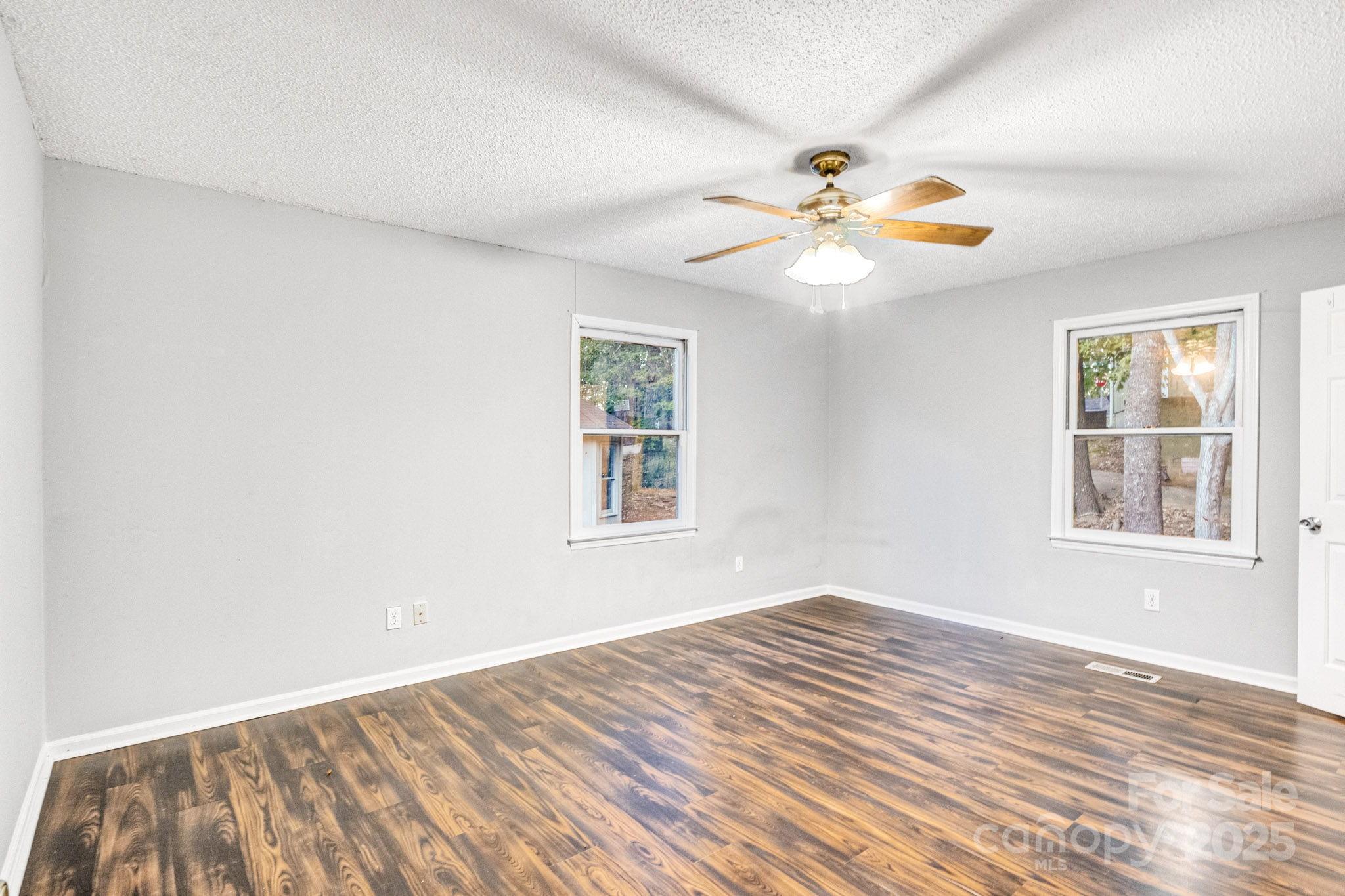 27097 Cove Lane Tega Cay, SC 29708 - Photo 14 of 30 a view of empty room with window and ceiling fan