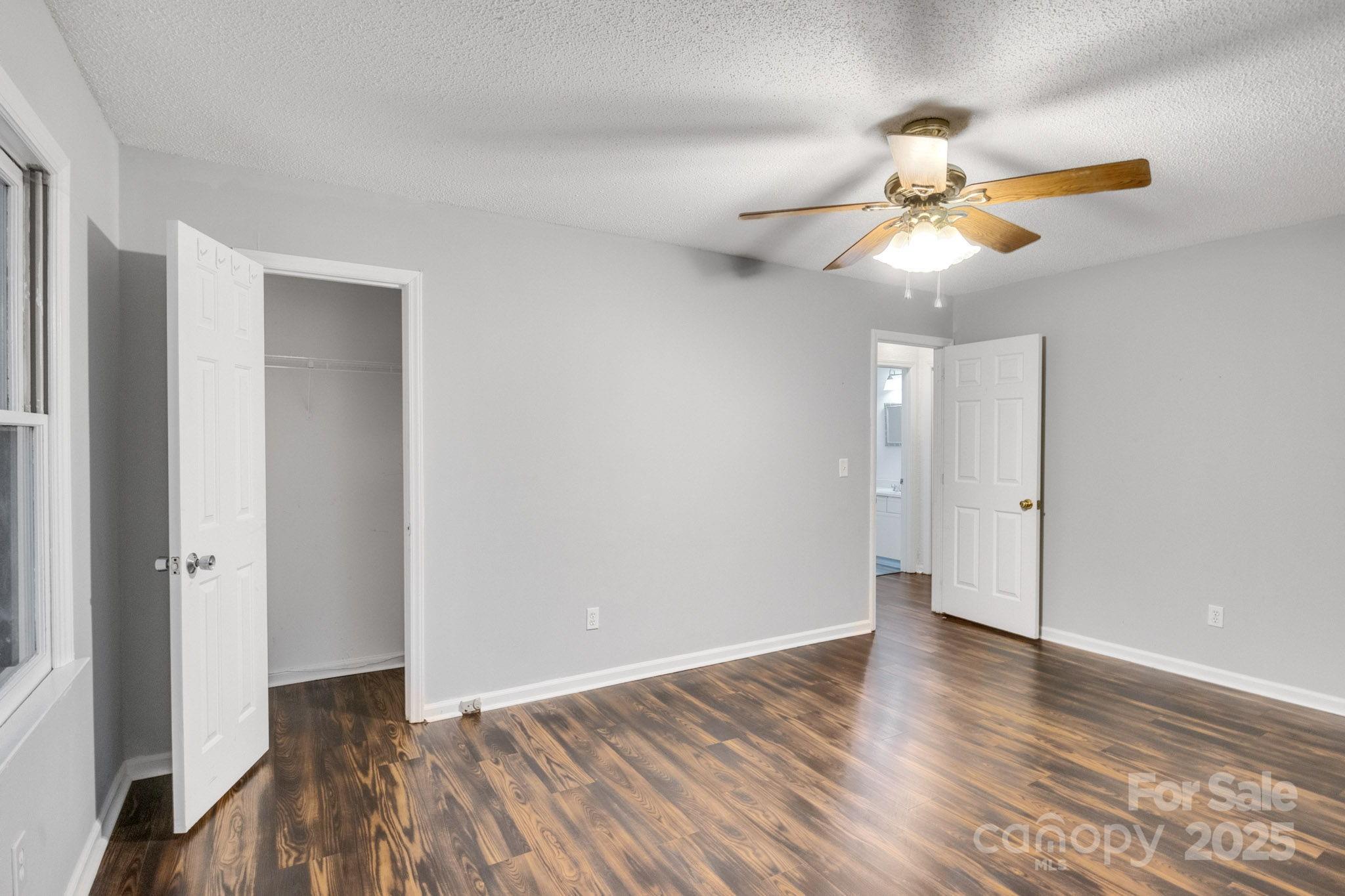 27097 Cove Lane Tega Cay, SC 29708 - Photo 15 of 30 wooden floor in an empty room with a window