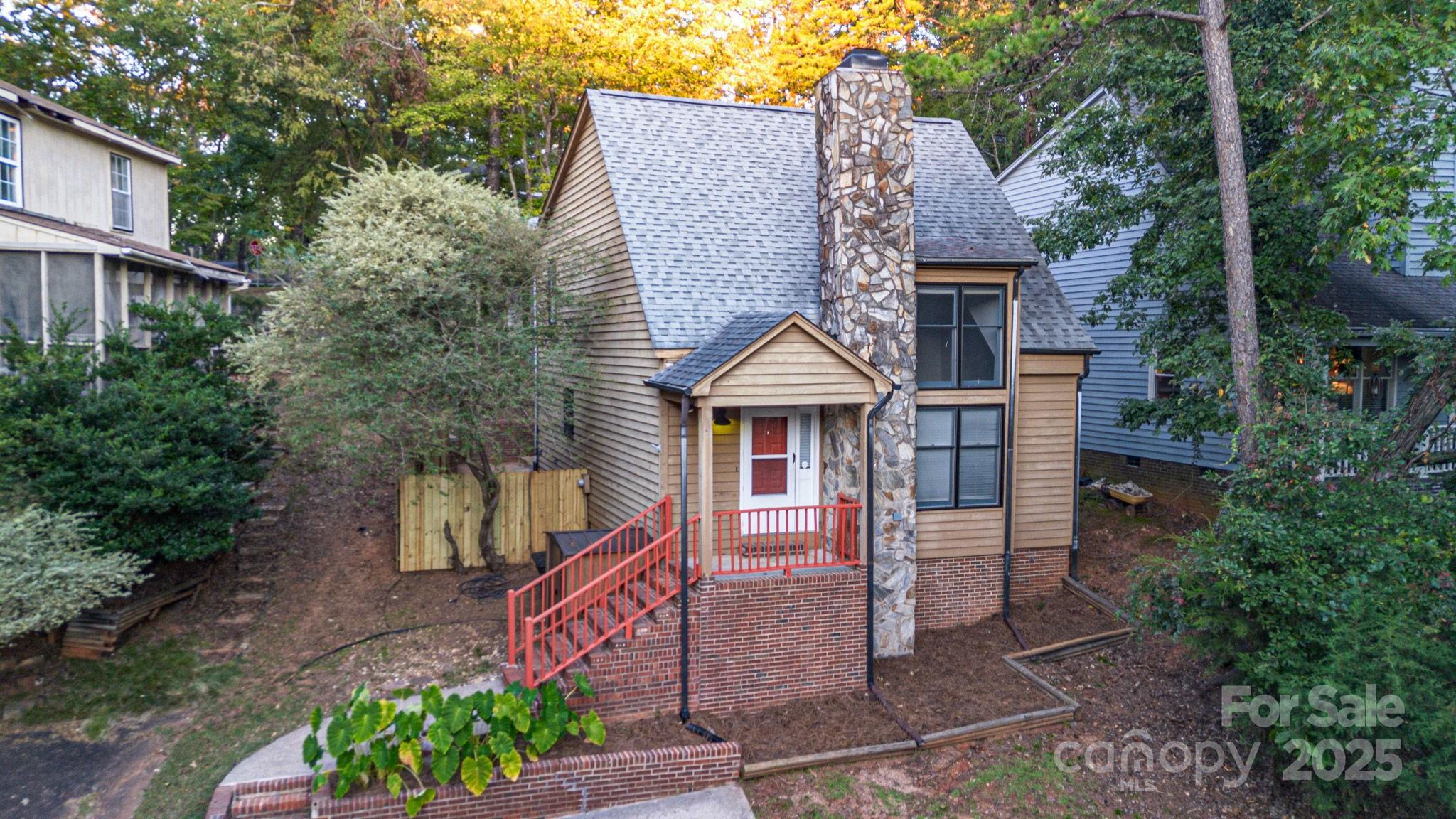 27097 Cove Lane Tega Cay, SC 29708 - Photo 2 of 30 a front view of a house with garden