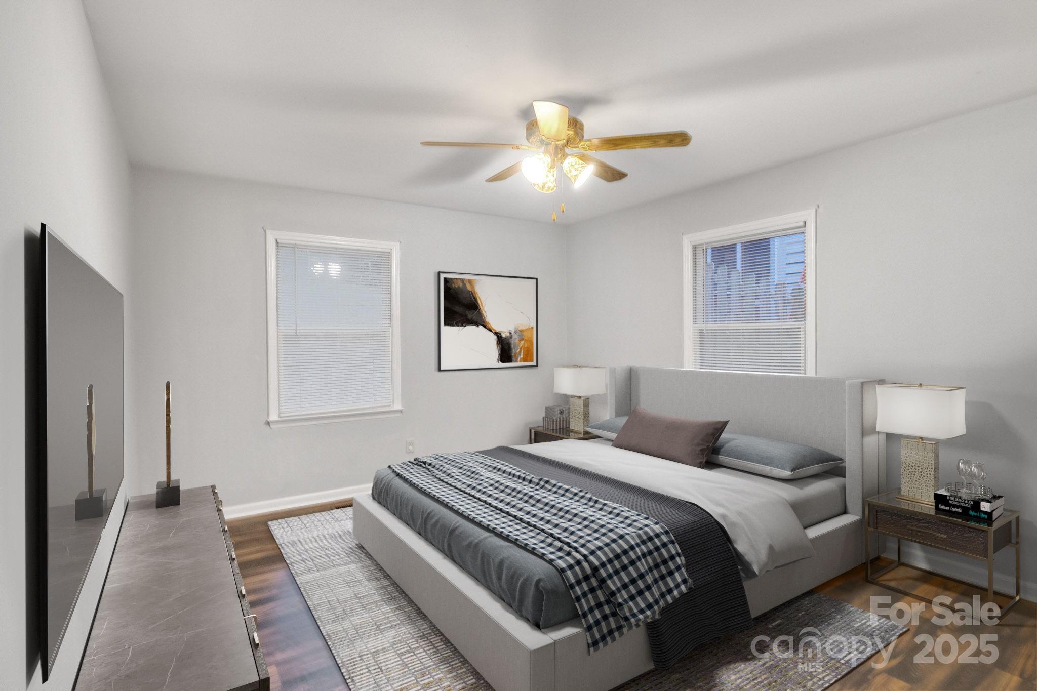 27097 Cove Lane Tega Cay, SC 29708 - Photo 21 of 30 a bedroom with a bed and a chandelier