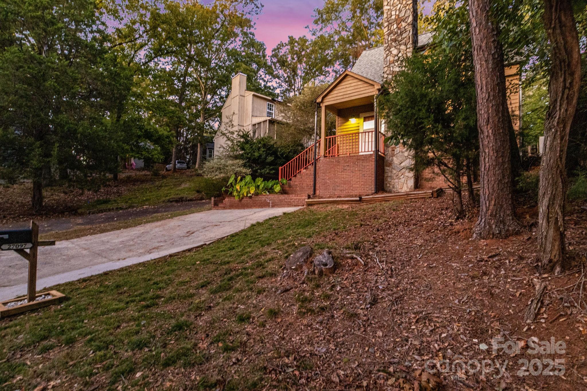 27097 Cove Lane Tega Cay, SC 29708 - Photo 29 of 30 a view of a house with a yard