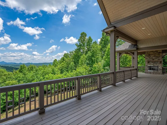 a view of a balcony with wooden floor