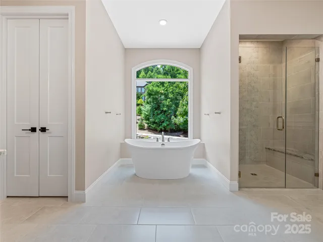 a bathroom with a bathtub and shower