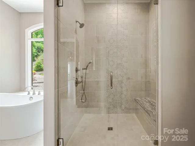 a bathroom with a shower and a sink