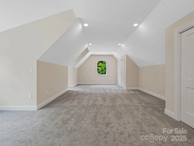 an empty room with a window and a fireplace