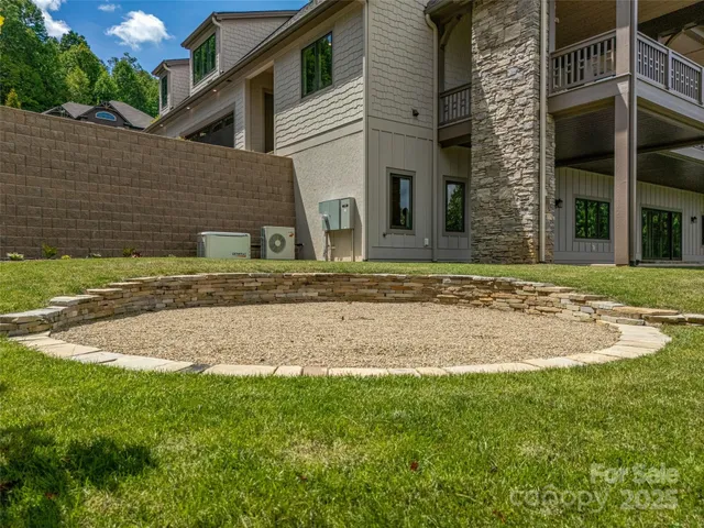 a view of a white house with a yard