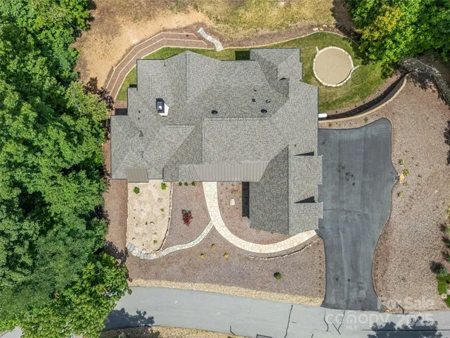 an aerial view of a highlighted house