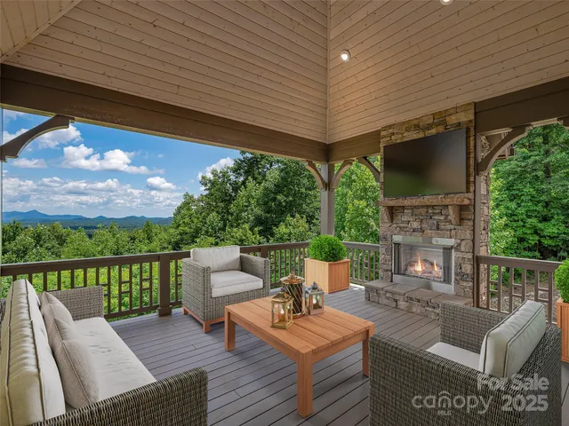 a view of a patio with couches chairs potted plants and a table