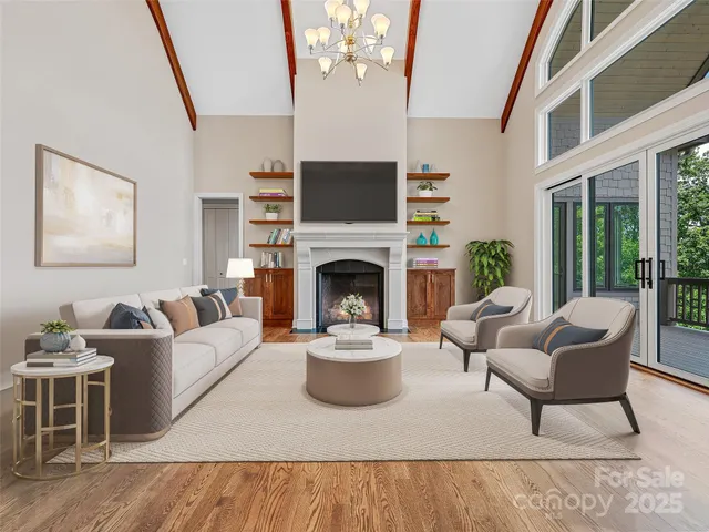 a living room with furniture a fireplace and a flat screen tv