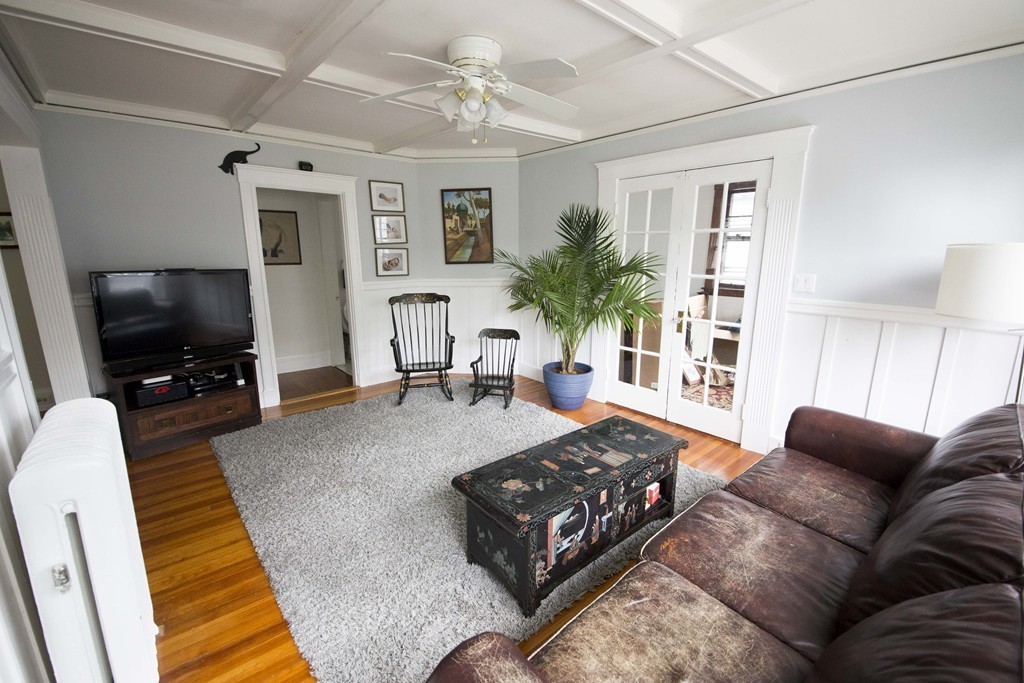 4 Nottingham Street, Unit 2 Newton, MA 02459 - Photo 4 of 18 a living room with furniture and a flat screen tv