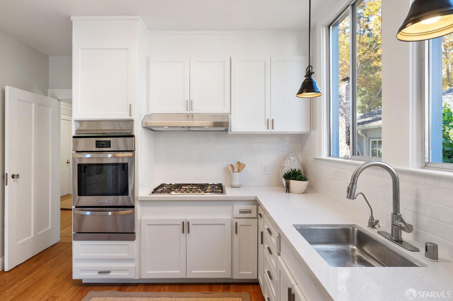 1616 Adeline Drive Burlingame, CA 94010 - Photo 20 of 67 a kitchen with granite countertop a stove and a sink
