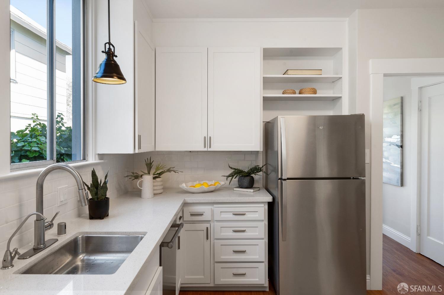 1616 Adeline Drive Burlingame, CA 94010 - Photo 21 of 67 a kitchen with a refrigerator and a sink