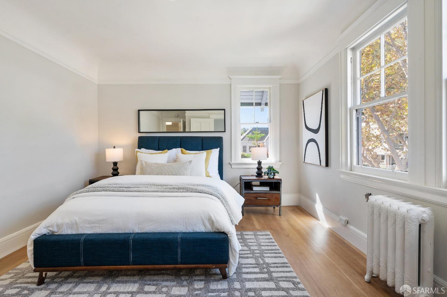 1616 Adeline Drive Burlingame, CA 94010 - Photo 30 of 67 a bedroom with a bed a mirror and a window